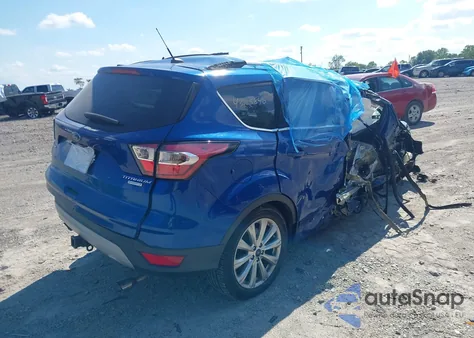 2017 Ford Escape Titanium z USA, uszkodzony, nr VIN 1FMCU0J9XHUF04442